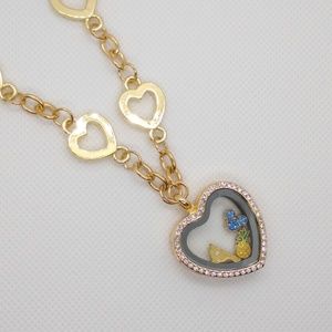 Jeweled floating heart locket